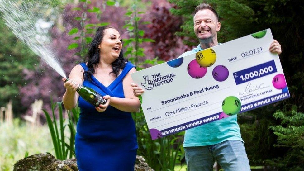 Sammantha Young and husband Paul with lottery cheque