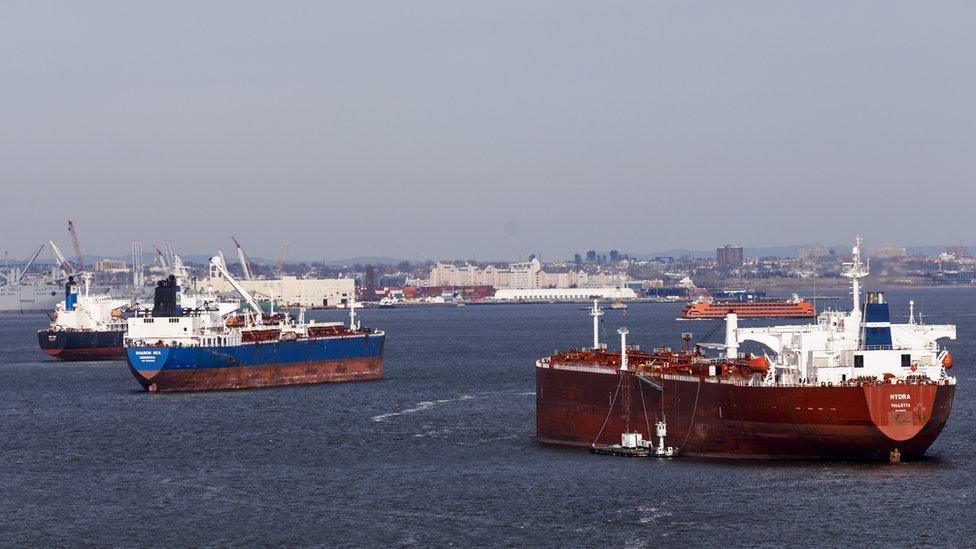 Cargo ships gather in New York harbour, in New York, New York, USA