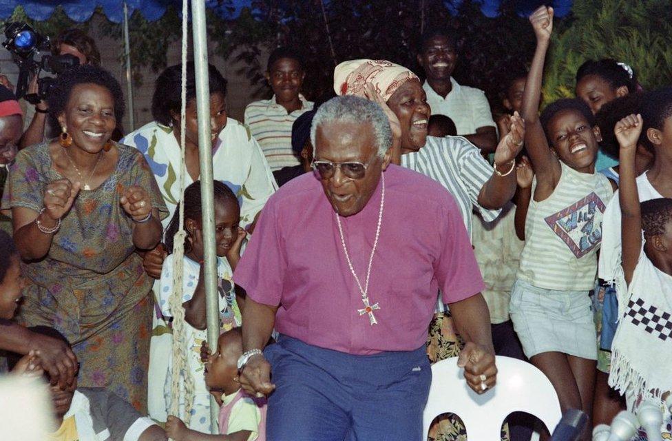 South African activist and Nobel Peace Prize and Anglican Archbishop Desmond Tutu reacts at announcement of the freedom of the anti-apartheid leader and African National Congress (ANC) member Nelson Mandela, on February 10, 1990 at his home in Soweto.