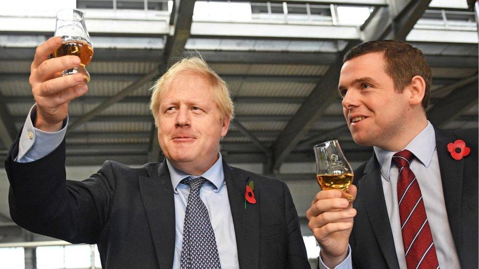 Prime Minister Boris Johnson alongside Douglas Ross