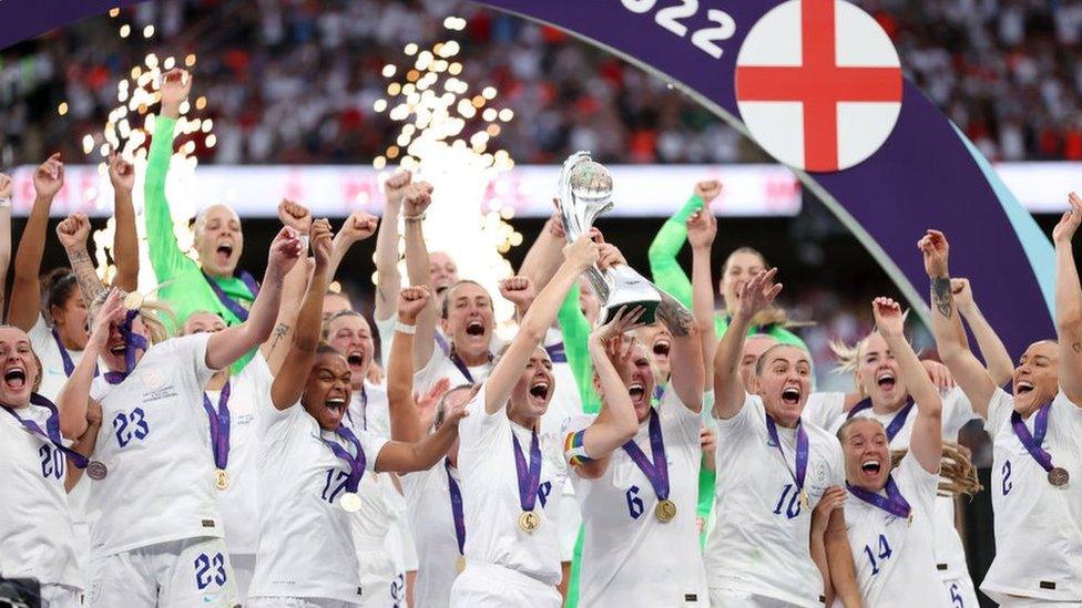 Lionesses celebrating with the Euros trophy