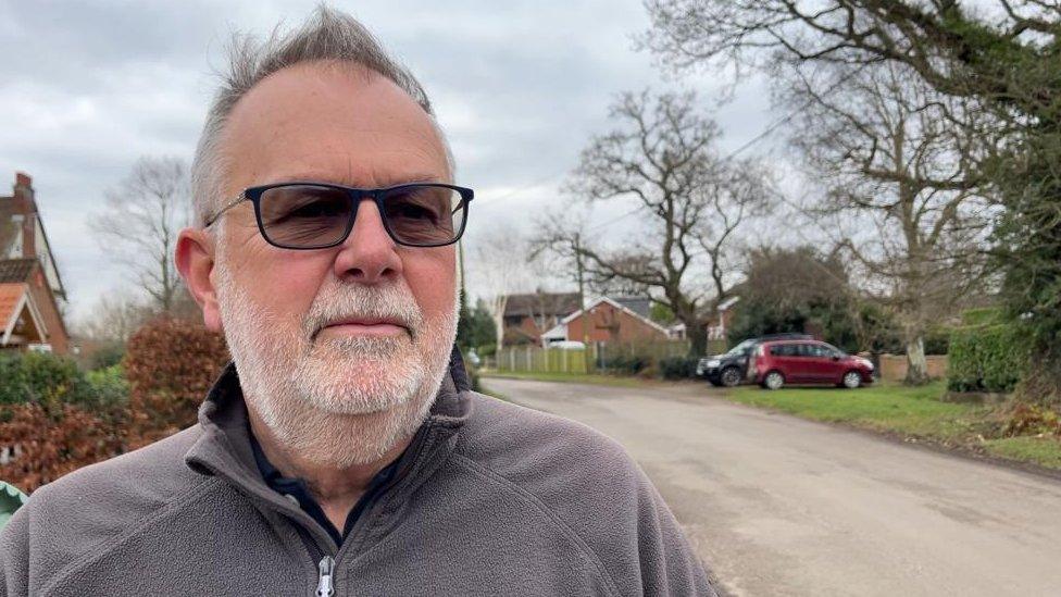 Steve Adkins stands by Staithe Road in Hickling