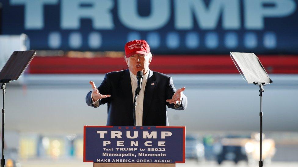 Republican US presidential nominee Donald Trump rallies with supporters in a cargo hangar at Minneapolis.