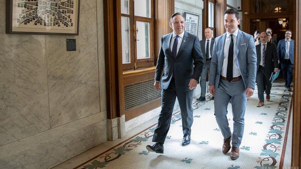 Quebec Premier Francois Legault (L) and Immigration and Diversity Minister Simon Jolin-Barette (R)