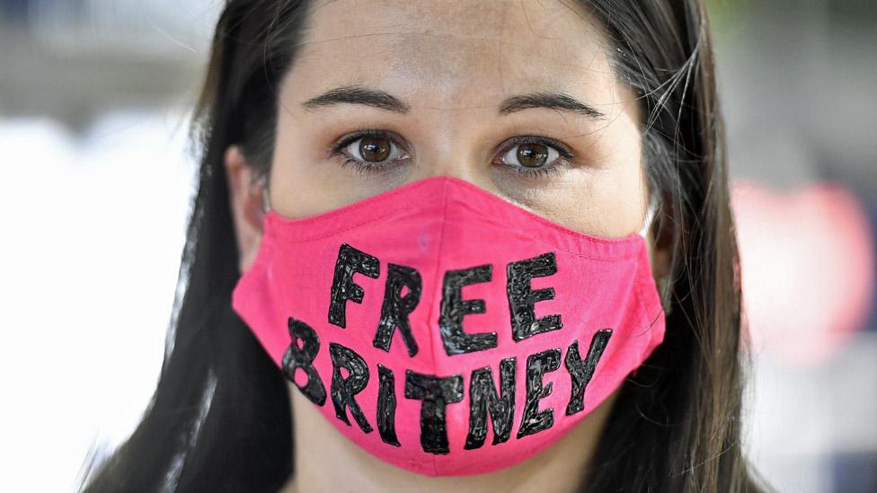 Britney Spears fan wearing a "Free Britney" mask outside court in July