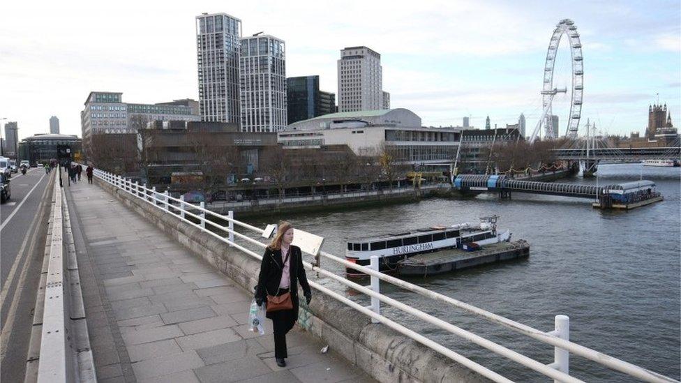 Commuter crosses an empty Waterloo Bridge