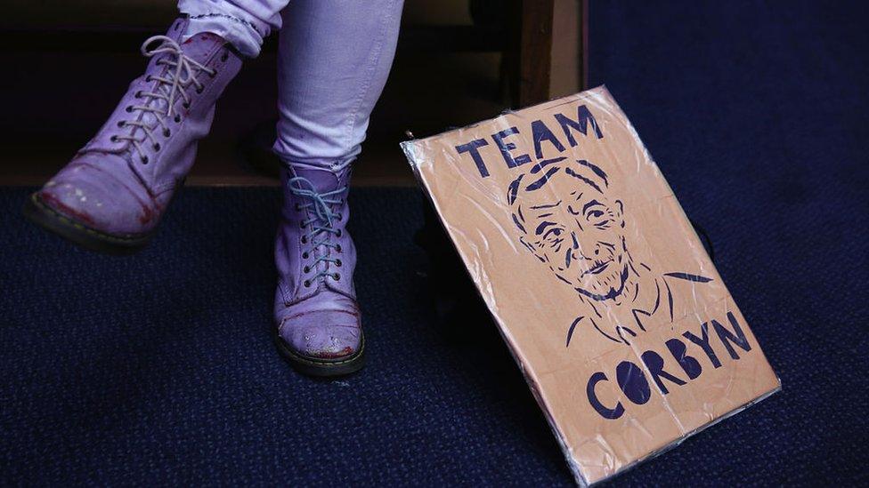 Jeremy Corbyn supporter with sign