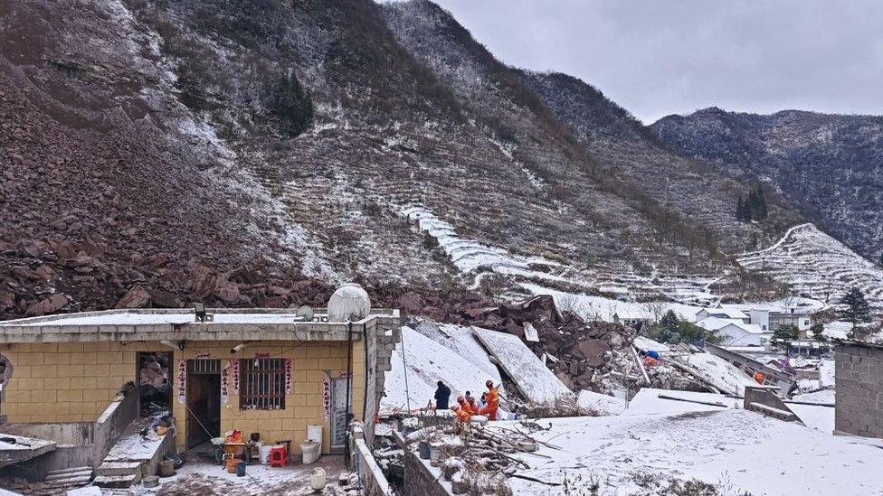 Rescuers search for survivors at the ruins of a landslide on January 22, 2024 in Zhenxiong County, Zhaotong City, Yunnan Province of China. The landslide has left 47 people buried on early January 22 in Zhaotong, Yunnan province.