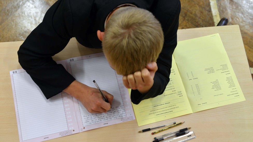 Schoolboy taking GCSE examination