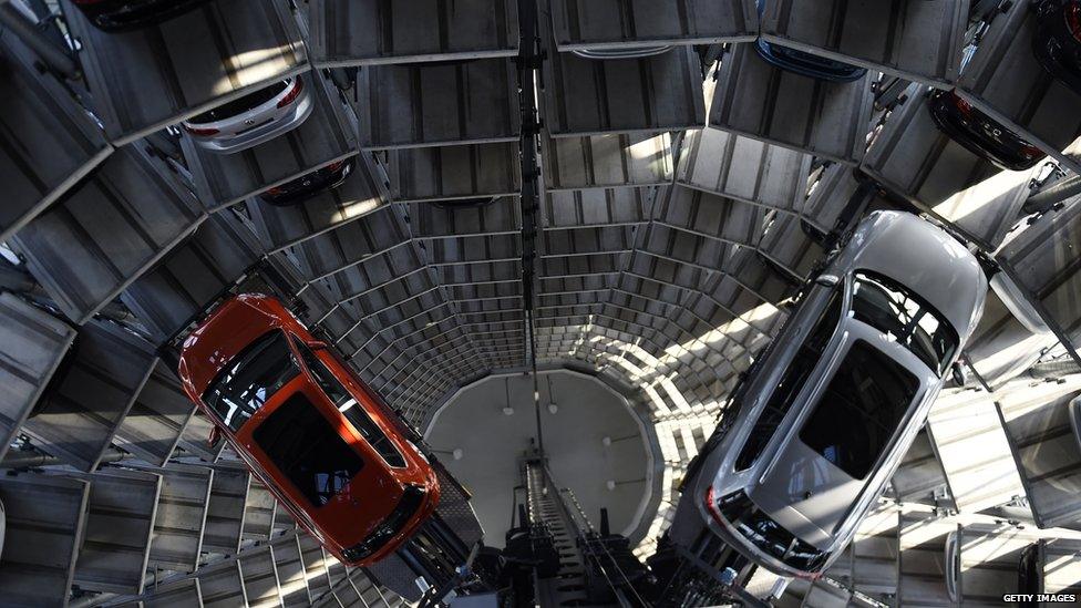 Two VW vehicles are pictured inside one of the company's so-called car towers