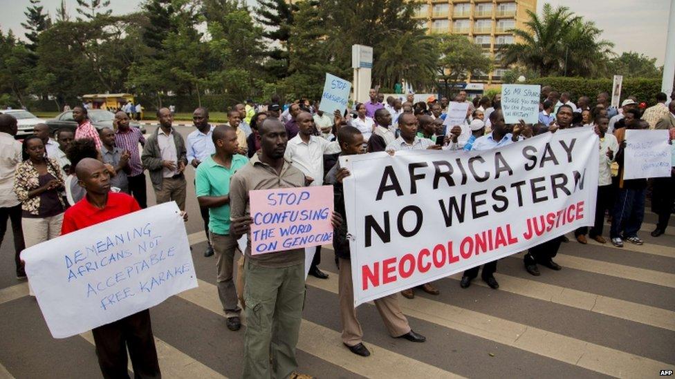 Rwandan nationals stage a demonstration outside the British High Commission in Kigali on June 25, 2015