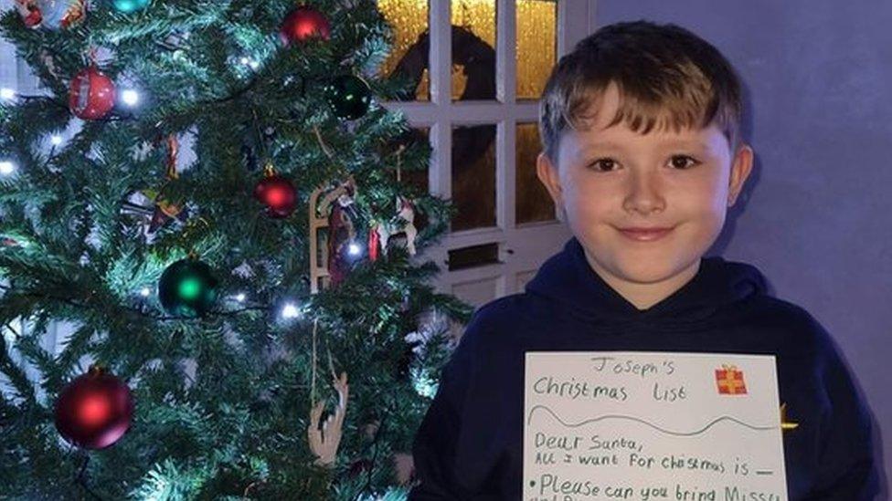 Child with Christmas list