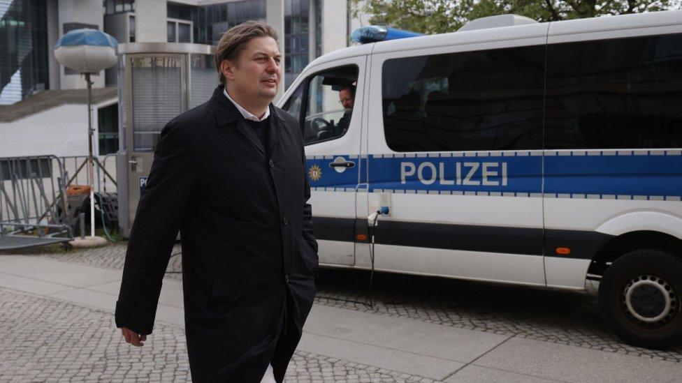 Maximilian Krah, member of the European Parliament for the far-right Alternative for Germany (AfD) political party, departs after speaking to journalists outside the Reichstag following a meeting between Krah and AfD leading members on April 24, 2024