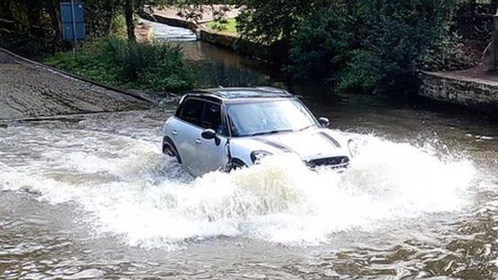 A Mini going through Rufford Ford