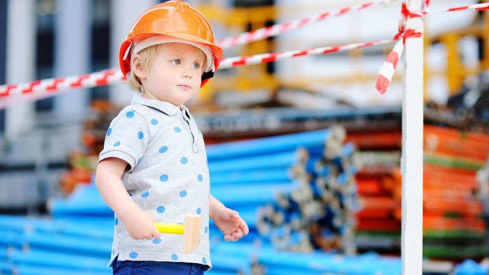 Boy dressed as builder