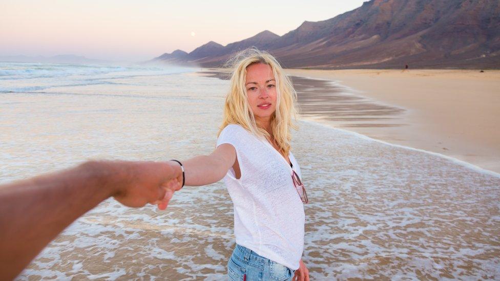 Couple on empty beach