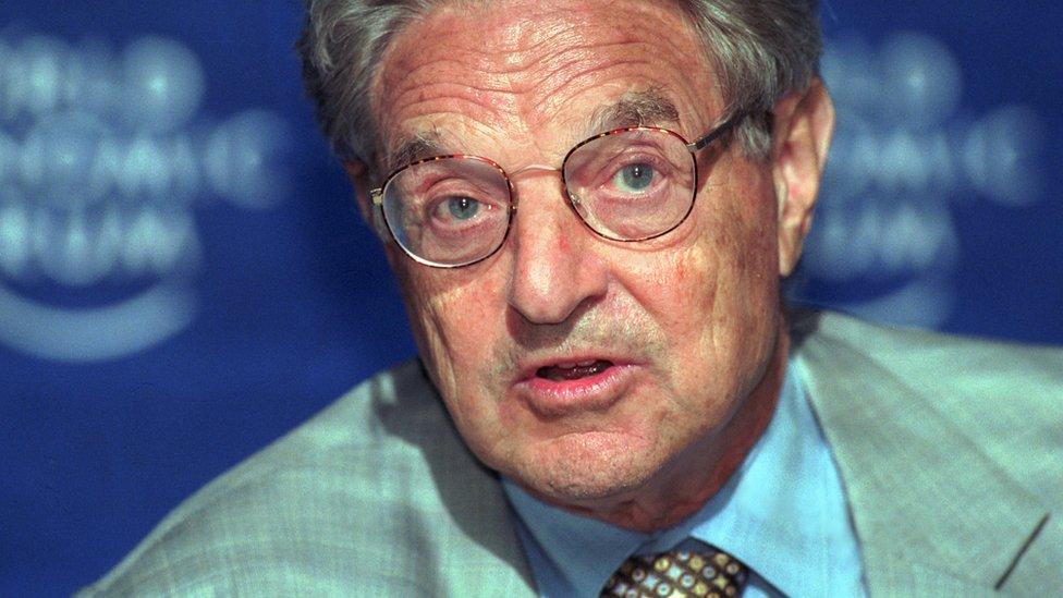 Billionaire investor and philanthropist George Soros speaks to reporters at the World Economic Forum June 3, 2001, in Salzburg, Austria