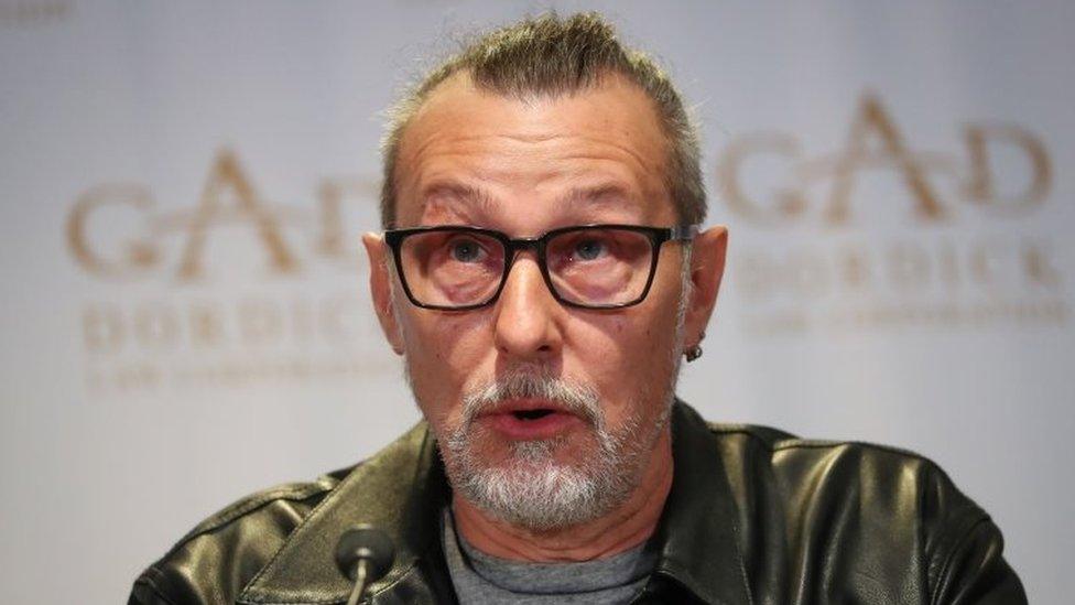 Serge Svetnoy speaks during a news conference in Los Angeles. Photo: 10 November 2021