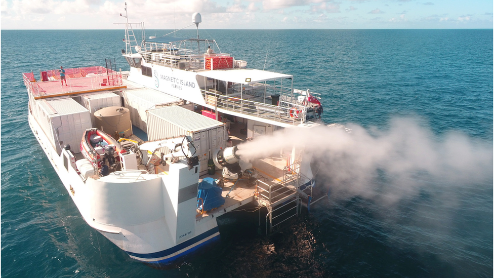 Machine on a boat spraying water spray into the air