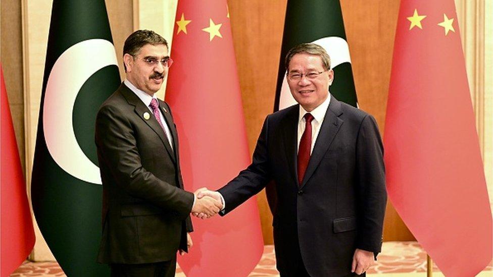 Anwar ul-Haq Kakar shakes hands with Li Qiang