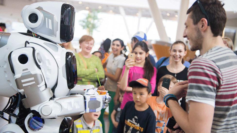 robot costume with crowd