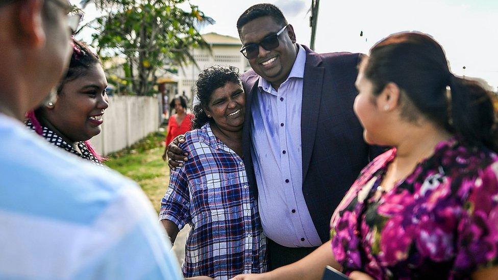 Irfaan Ali with wife and supporters in Leonora