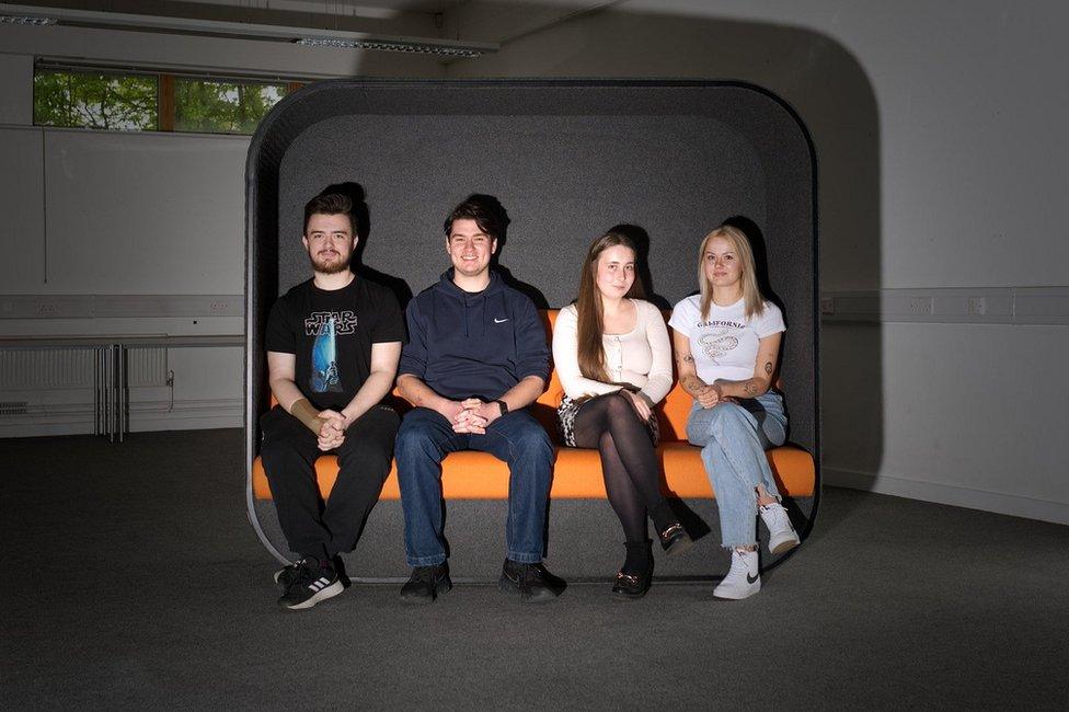 first time voters from Harlow photographed on an orange sofa together