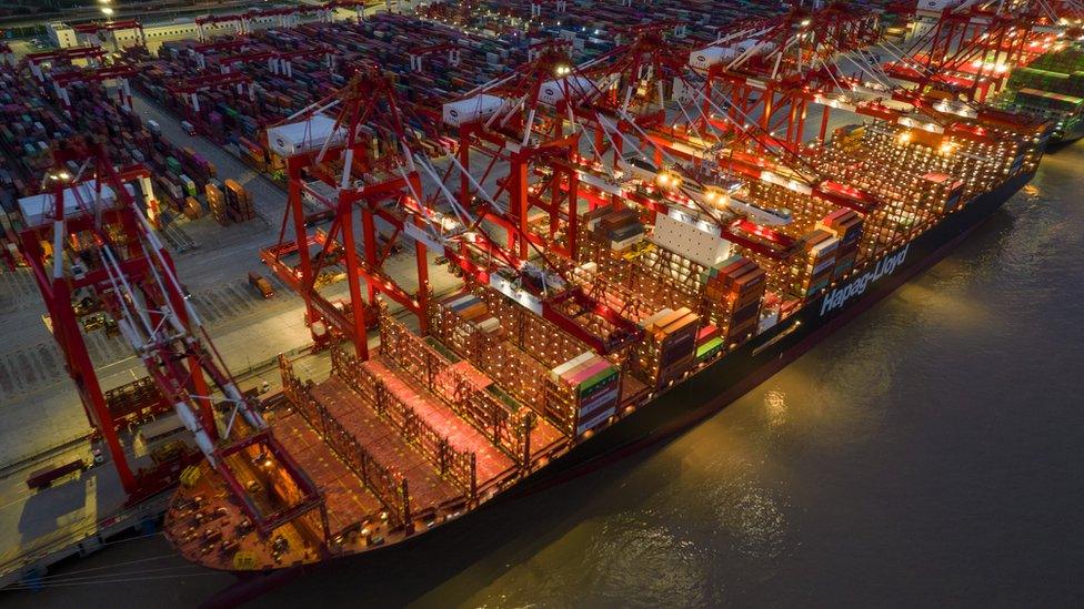 A containers ship being loaded at Shanghai Yangshan deep water port