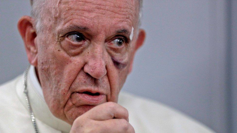 Pope Francis talks to journalists during a press conference aboard a plane to Rome at the end of his visit to Colombia September 11, 2017