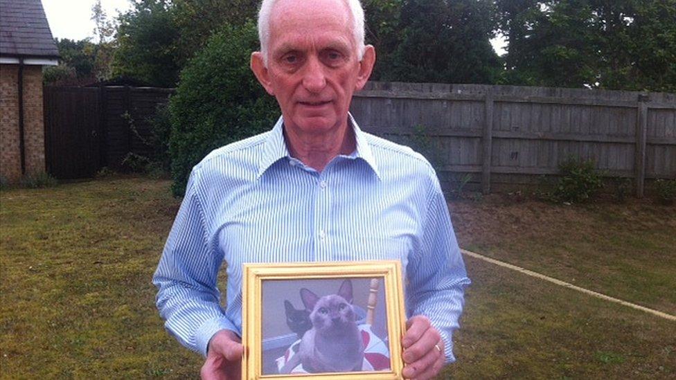 Peter Bryson with a photo of Merlin