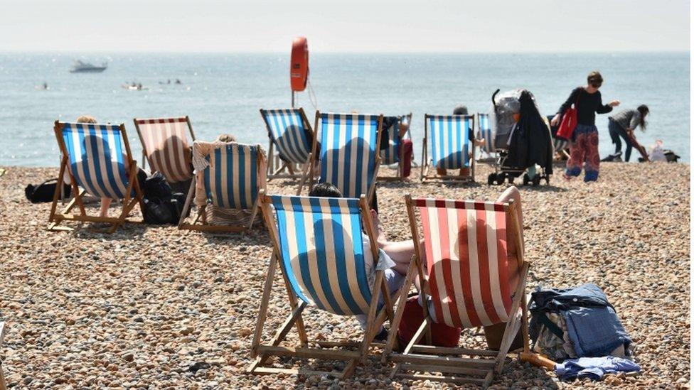 Beachgoers in Brighton, UK