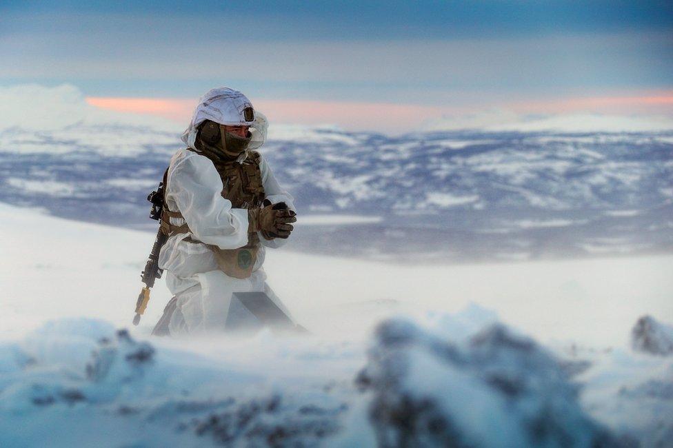 A Royal Marine works in the Arctic Circle