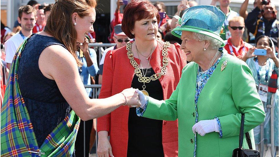 Queen Elizabeth meets delegates and athletes on a visit to the Athletes' Village during day one of the 2014 Commonwealth Games in Glasgow