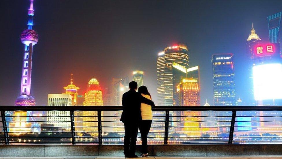 Couple looking at Shanghai skyline