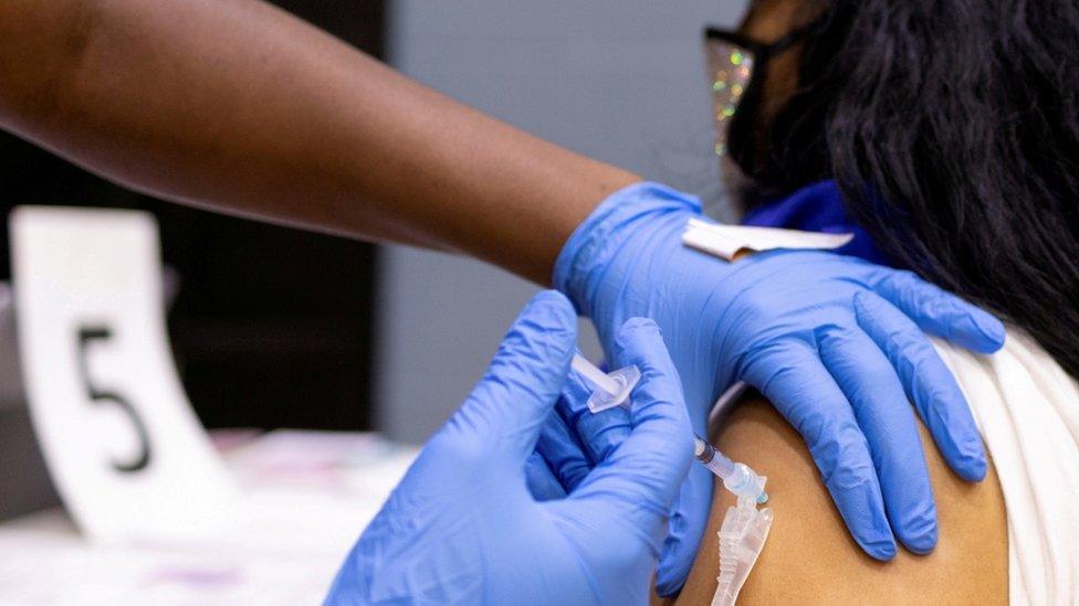 A woman receives a COVID-19 vaccine at a clinic in Philadelphia, Pennsylvania, U.S., May 18, 2021.