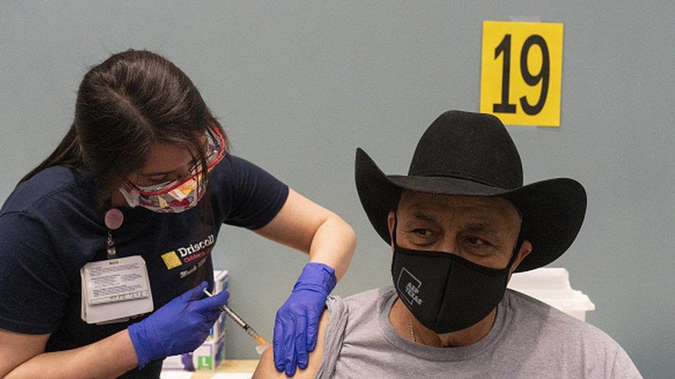 A person receives the Moderna Covid-19 vaccine at the American Bank Center in Corpus Christi, Texas