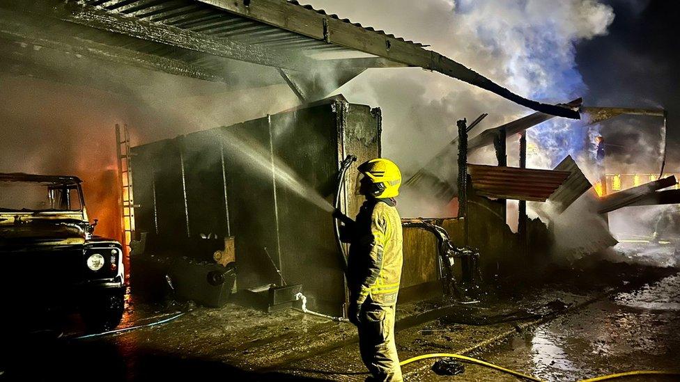 Fire fighter tackling blaze