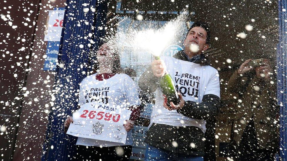 Laura Puentes and her husband Pablo celebrate selling the winning ticket of the biggest prize in Spain's Christmas lottery "El Gordo" (The Fat One) in Barcelona, 22 December, 2019.