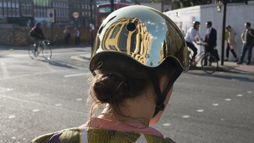 Woman wearing a bicycle helmet