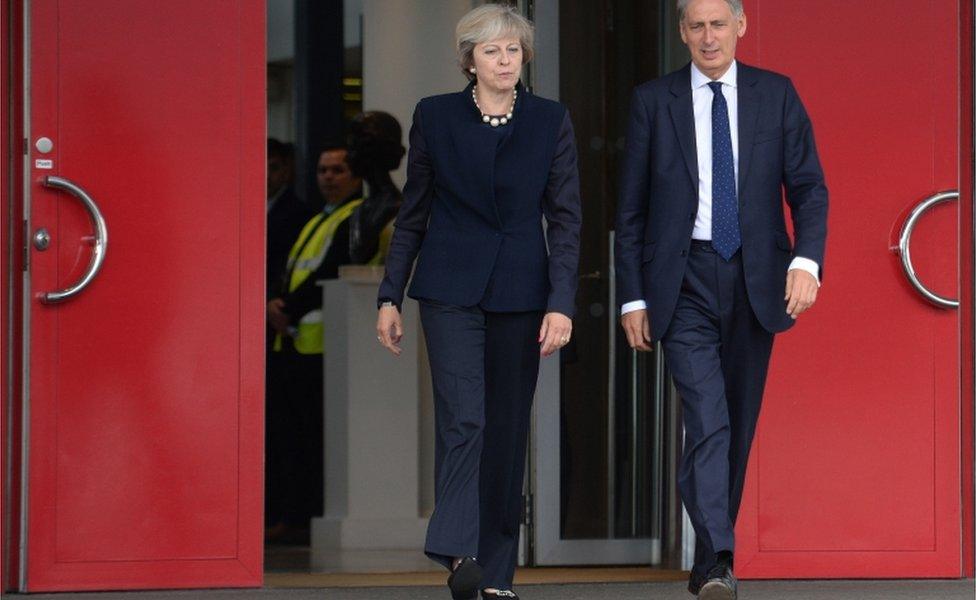 Prime Minister Theresa May and Chancellor of the Exchequer Philip Hammond at Heathrow