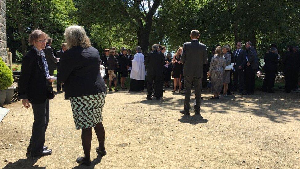 People gathered outside St Peter's Church