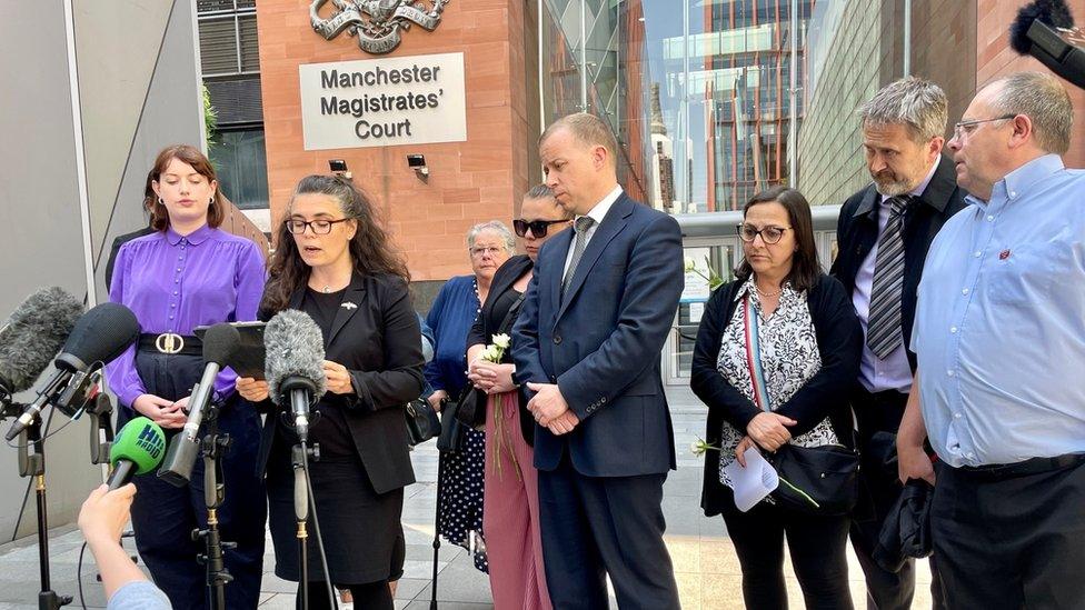 Families of the victims outside the court