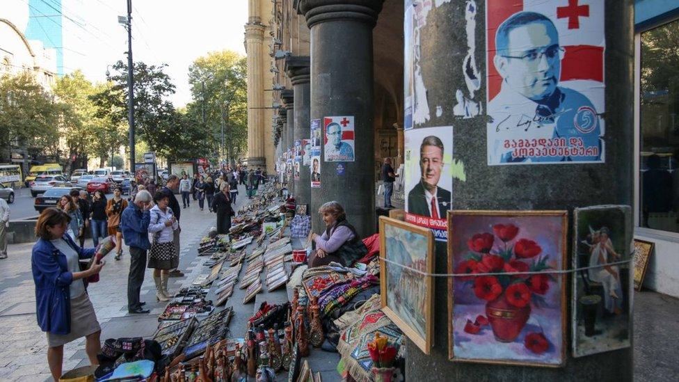 Posters of candidates adorn pillars in Tbilisi, Georgia