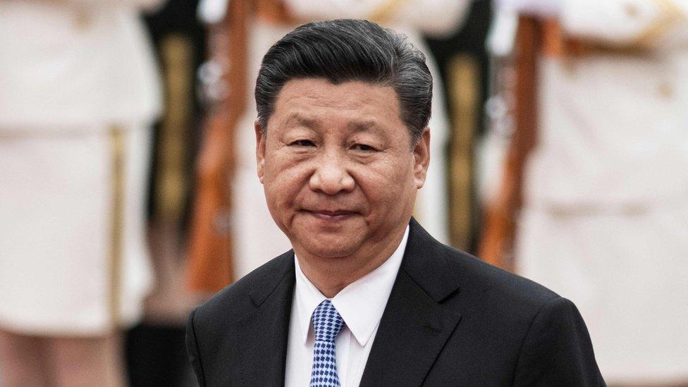 China"s President Xi Jinping reviews honour guards during a welcome ceremony with Kyrgyzstan"s President Sooronbai Jeenbekov at the Great Hall of the People in Beijing on June 6, 2018.