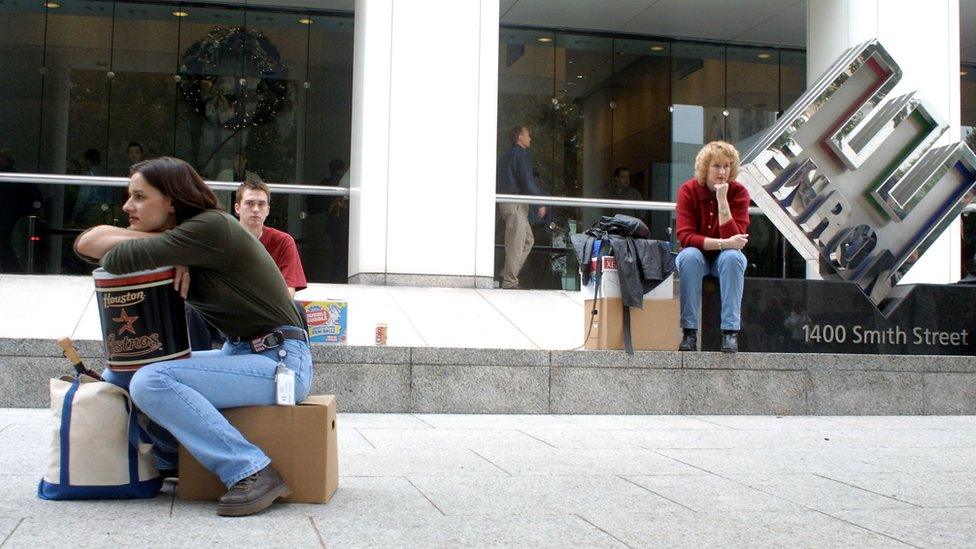 Employees with their belongings after Enron collapsed in December 2001