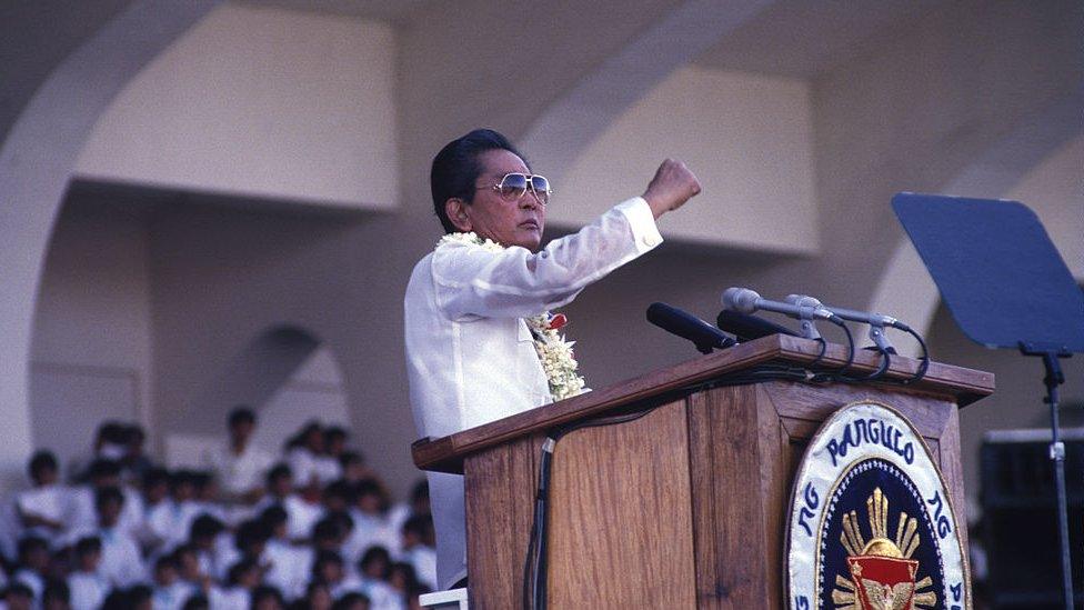 Image shows Ferdinand Marcos Sr speaking to supporters