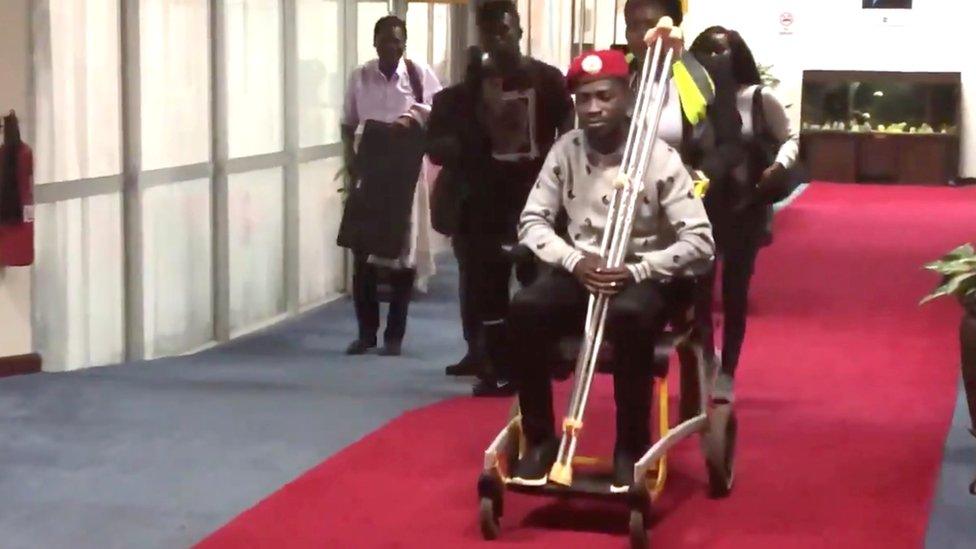 Bobi Wine in a wheelchair just prior to his departure at Entebbe International Airport, Uganda, 31 August 2018