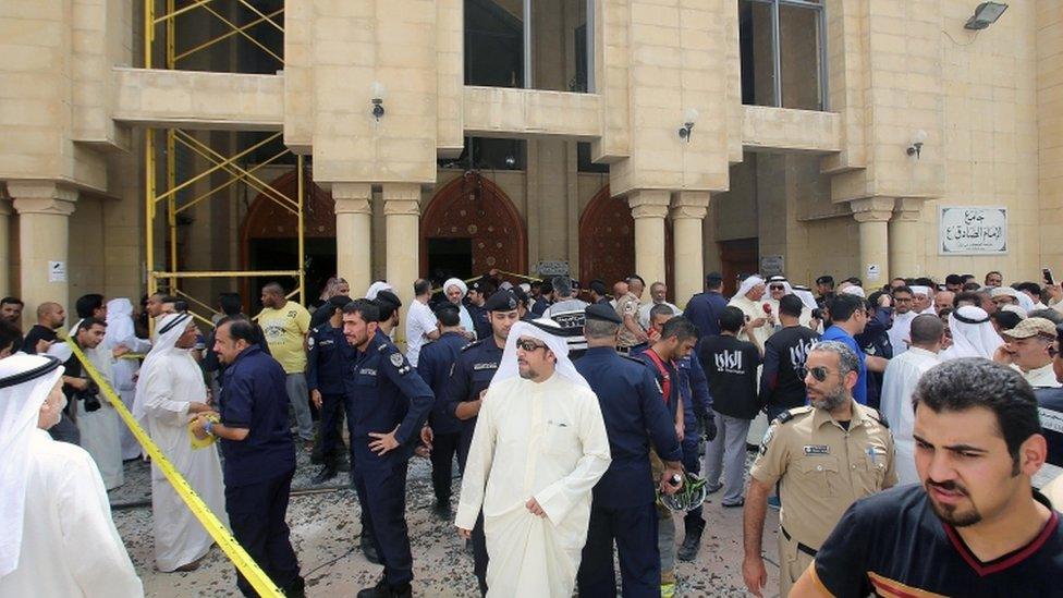 Kuwaiti security forces gather outside the Shiite Al-Imam al-Sadeq mosque after it was targeted by a suicide bombing during Friday prayers on 26 June 2015, in Kuwait City