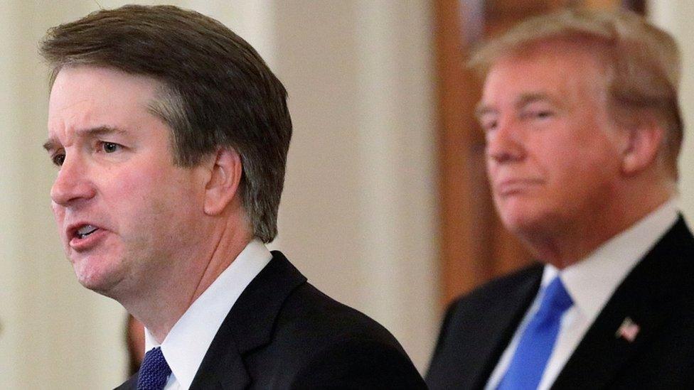 US President Donald Trump listens to his nominee for the US Supreme Court Brett Kavanaugh speak during his nomination announcement at the White House in Washington on, 9 July 2018