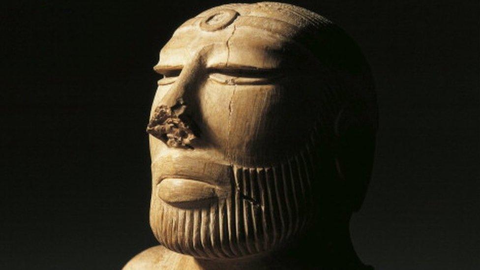 Bust of a Priest King wearing a cloak decorated with clovers, Harappan period, Steatite once coated in pink paste